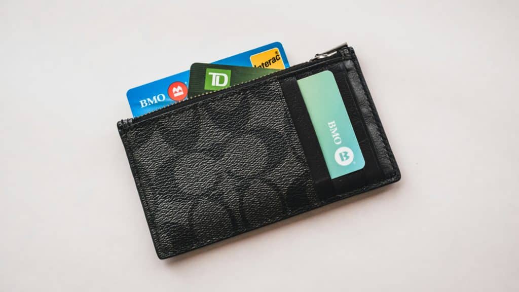 Wallet of a debtor with credit card showing, people tracing can locate debtors when required