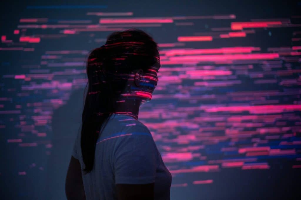 People tracing in the UK - how it works - picture of lady in digital light